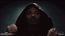 a man is wearing a hooded jacket with the words ironheart on the bottom