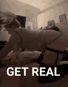 a woman is laying on a man 's lap and the words get real are visible