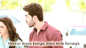 a man and a woman are standing next to each other with the words mera jo mann karega main wohi karunga written below them