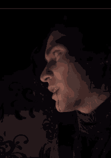 a close up of a man 's face with blood dripping from his mouth