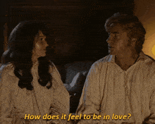 a man and a woman are looking at each other and the man is asking the woman how does it feel to be in love