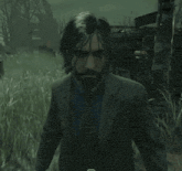 a man in a suit and tie holds a tambourine in his hands