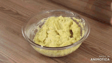 a glass bowl filled with mashed potatoes with the words made in animotica on the bottom