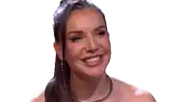 a woman wearing a choker and earrings is smiling on a white background