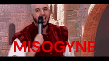 a man singing into a microphone with the word misogyne written in red