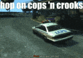 a lcpd police car is driving down a street with the words hop on cops 'n crooks above it