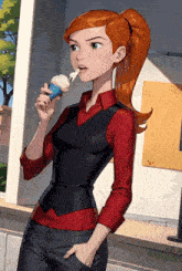 a woman in a red shirt and black vest is holding an ice cream cone with whipped cream on it