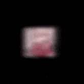 a blurred image of a girl 's face with pink hair
