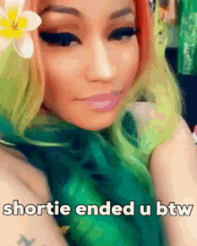 a woman with green hair has a flower in her hair and the words shortie ended u btw on the bottom