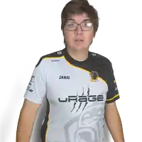 a man wearing glasses and a jako urage t-shirt