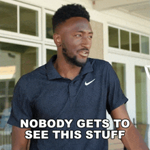 a man wearing a nike polo shirt says nobody gets to see this stuff