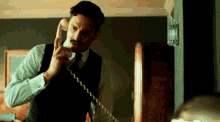 On The Telephone Talking On The Phone GIF - On The Telephone Talking On The Phone Making A Call GIFs