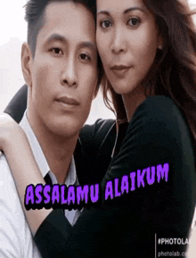 a man and a woman are hugging each other with the words assalamu alaikum written on the bottom .