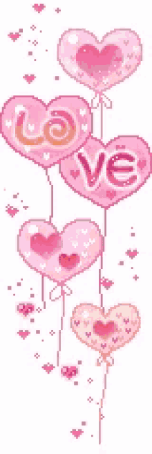 a group of pink heart shaped balloons with the word love written on them
