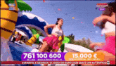 a woman in a pink skirt is dancing in front of a water slide with the number 761 100 600 on the bottom