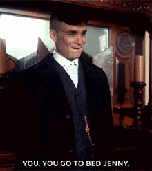 a man in a suit and tie says you you go to bed jenny