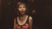 a blurry picture of a woman with her eyes closed and her hands outstretched