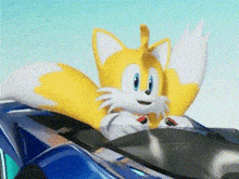 tails from sonic the hedgehog is riding a blue car .