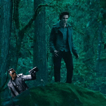 a man in a blue jacket is holding a gun in a forest