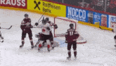 a hockey game is being played in front of an advertisement for nocco