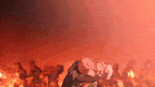 a man and a woman are hugging each other in front of a crowd of people .