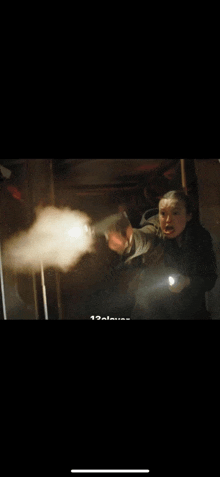 a man is holding a gun and a woman is holding a flashlight