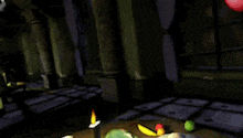 a video game scene with a candle and fruit on the ground