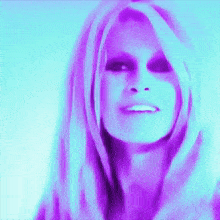 a close up of a woman 's face with purple and blue lines on it