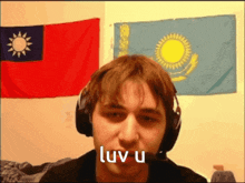 a man wearing headphones and a microphone says luv u