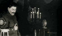 a black and white photo of a man with a smithsonian channel logo on the bottom