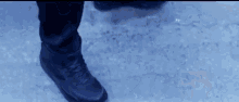 a close up of a person 's foot in the snow .