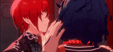 a person with red hair is touching another person 's head