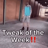 a man is standing in a hallway with the words `` tweak of the week '' written on the ground .