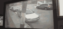 a car is parked on the side of the road in front of a camera that says cam25