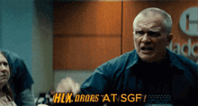 a man says " hlx drops at sgf " in front of a sign