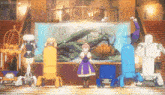 a girl is standing in front of a large aquarium with robots in front of it