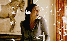 Elena Gilbert Feathers Floating Around Her In A Spell GIF - Elena Gilbert Feathers Floating Around Her In A Spell The Vampire Diaries GIFs