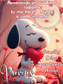 a picture of snoopy holding a heart with the words " renaciendo en tu amor " on it
