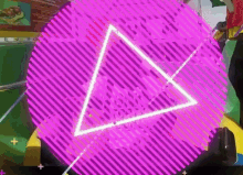 a purple circle with a triangle in the middle of it