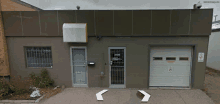 a building with a sign that says ' no parking ' on it