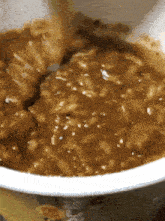 a close up of a bowl of food with a yellow background