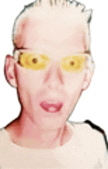 a man wearing yellow sunglasses and a white shirt is making a funny face .