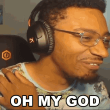 a man wearing headphones and glasses is making a funny face and says oh my god