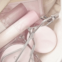 a bag filled with cosmetics including a lip balm that says r & r
