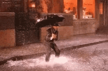 man excited raining jumping splash