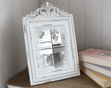 a white picture frame with a book titled global marketing on it