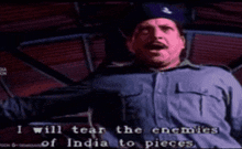 a man in a blue shirt says i will tear the enemies of india to pieces