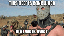 a man wearing a helmet with the words this beef is concluded just walk away written on it