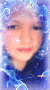 a close up of a woman 's face with blue smoke surrounding it
