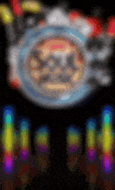 a blurred image of a circle and a rainbow of lights